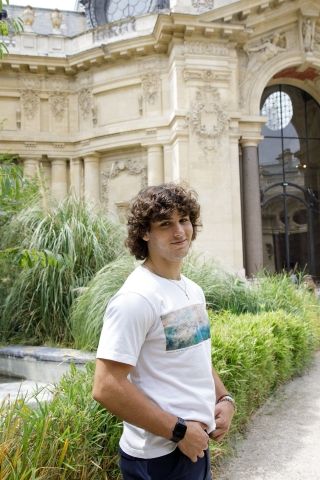High school student posing in garden in France
