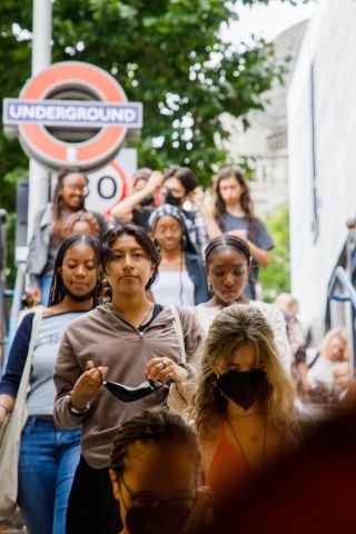 High schoolers abroad entering London underground