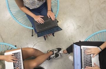 student intern meeting laptops it