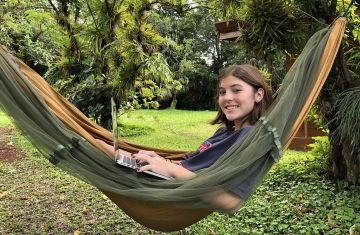 student in hammock studying abroad