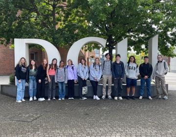 The GE cohort standing in front of a Dublin City University sign while on a quick trip to DCU's business campus.