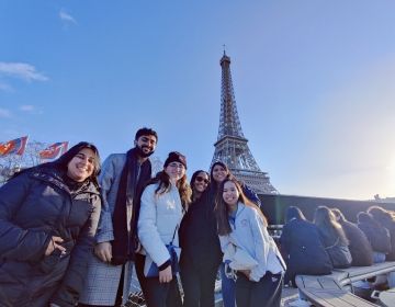 Students posing in front of the Eiffel Tower