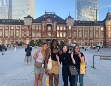 Students posing outside Tokyo Station