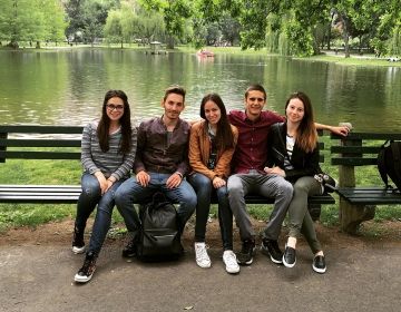 europe students relax park bench
