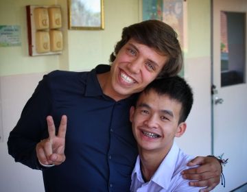 Teach in Thailand teacher with student