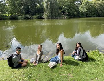 High schoolers relaxing by a lake in Copenhagen