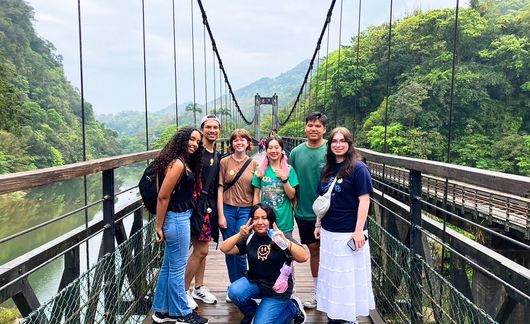 taipei students on bridge forest in background