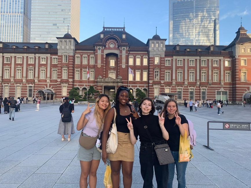 Students posing outside Tokyo Station
