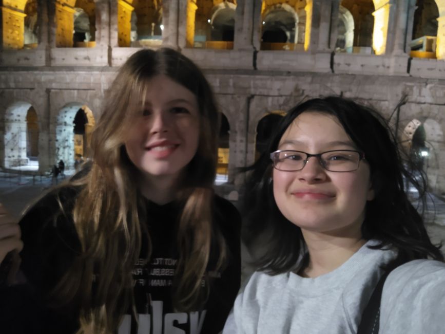 Me with a friend in front of the Colosseum in Rome