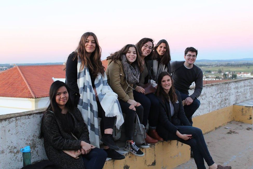 High school students on the roof of a building in Lisbon at sunset