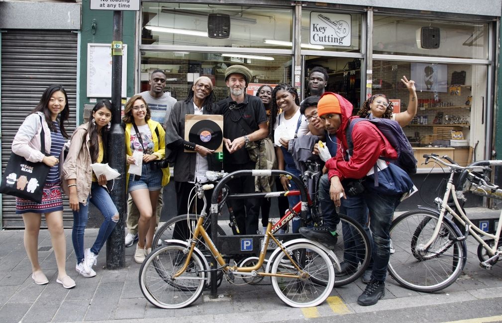 students biking record store london fdgf