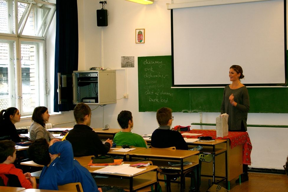 Teacher with students in classroom in Hungary