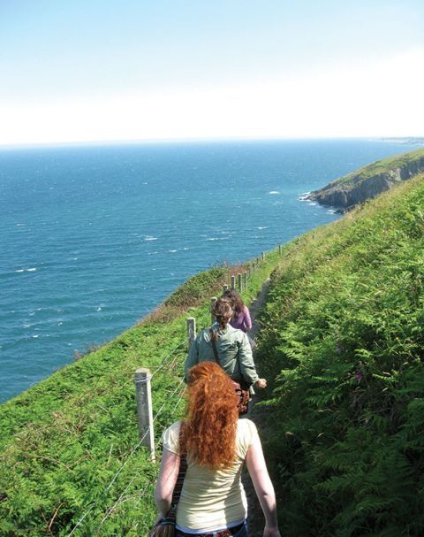 study abroad students hike ireland coast
