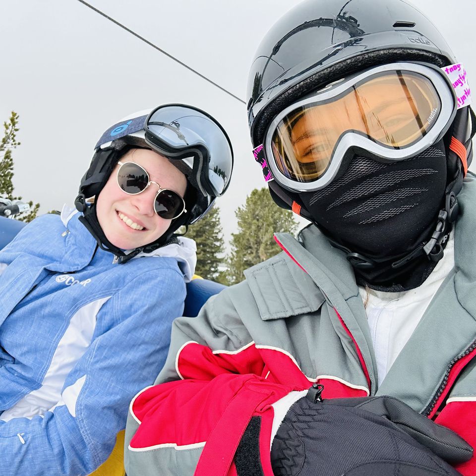 Two young women in ski gear in Cavalese, Italy