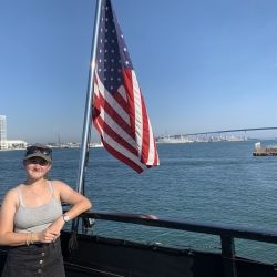 Me being on a ferry in SD with the American Flag