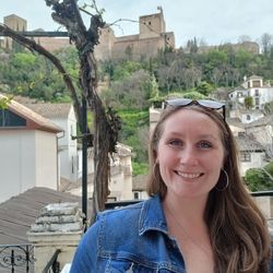 A picture of Elizabeth in front of the Alhambra in Granada, Spain.