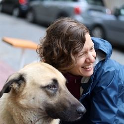 Woman with dog in street