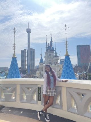 Photo of the author, Kristie, in front of Lotte Worlds iconic Castle