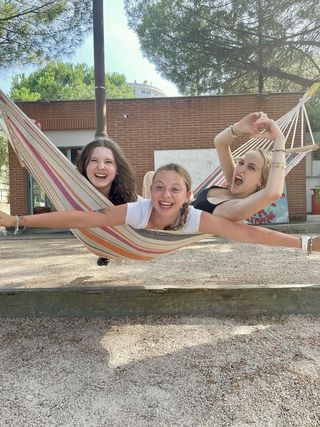 Three high school girls in a hammock