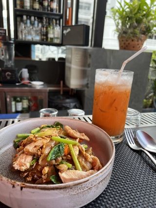 stir fried/drunken noodles/pad see ew with an iced thai milk tea