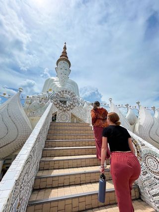 Teachers walking up temple staircase