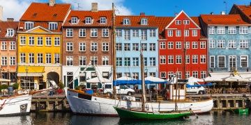 Copenhagen boats in canal by houses