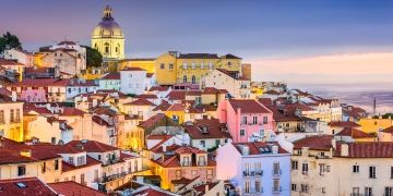 colorful houses along lisbons coast sunset