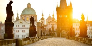 Prague Charles Bridge statues at sunrise