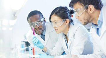 Scientists analyzing a test tube