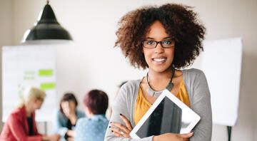 Businesswoman holding a tablet in an office
