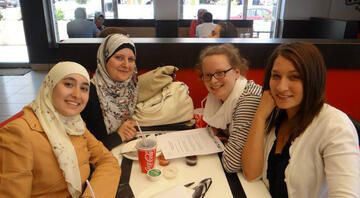 study abroad amman students eating with professor