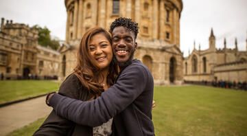 students smile together abroad london