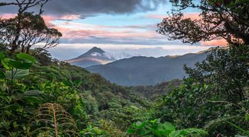 mountains in costa rica with sunset and jungle