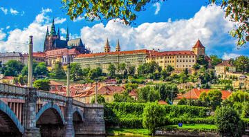 prague river bridge church hill