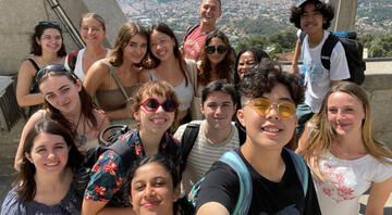 students abroad top of tower overlook