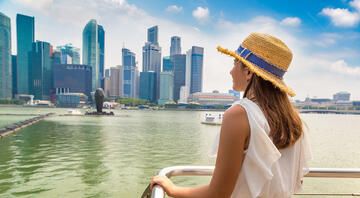 singapore girl on boat looking at buildings