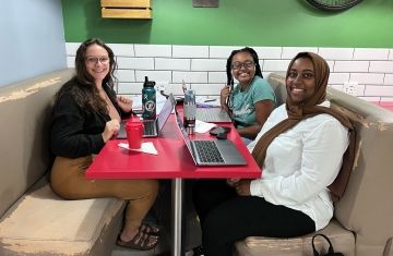 students working together at table in chile