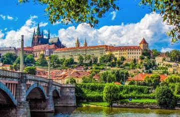 prague river bridge church hill