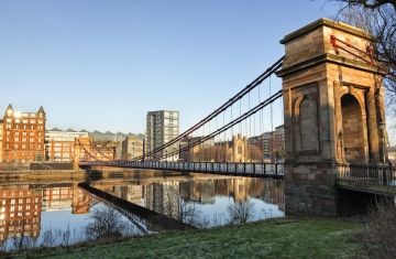 glasgow bridge over river at sunset