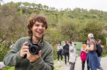 seville-smiling-guy-camera-hiking