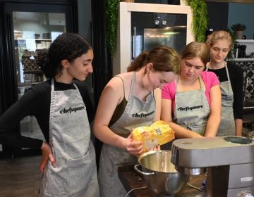 Pouring flour into a mixer