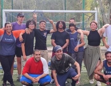 CIEE students standing for a picture in front of a soccer goal at Rabat's Hilton Park