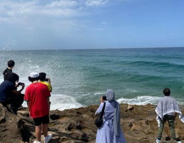 Nepu and other students onlooking the Atlantic Ocean in Tangier near Hercules Cave