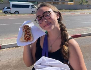 Holding a huge hotdog at the UB front gate