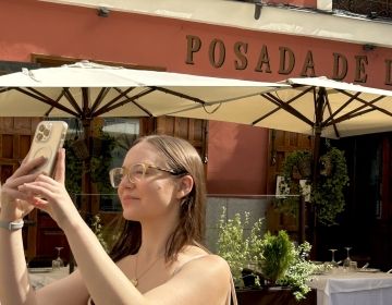 Deirdre standing in Centro Madrid taking a photo 