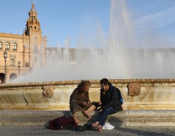 spain plaza de espana people sitting fountain