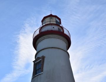 A lighthouse against a blue sky