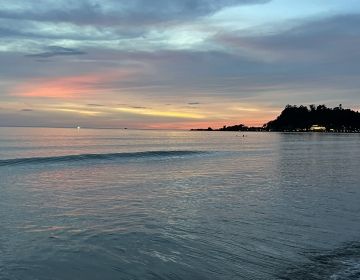 Picture of a beach on Koh Chang with a sunset in the background.