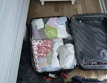 study abroad student suitcase packing