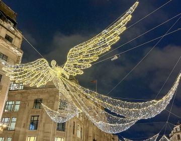 an angel made of lights in the streets of london